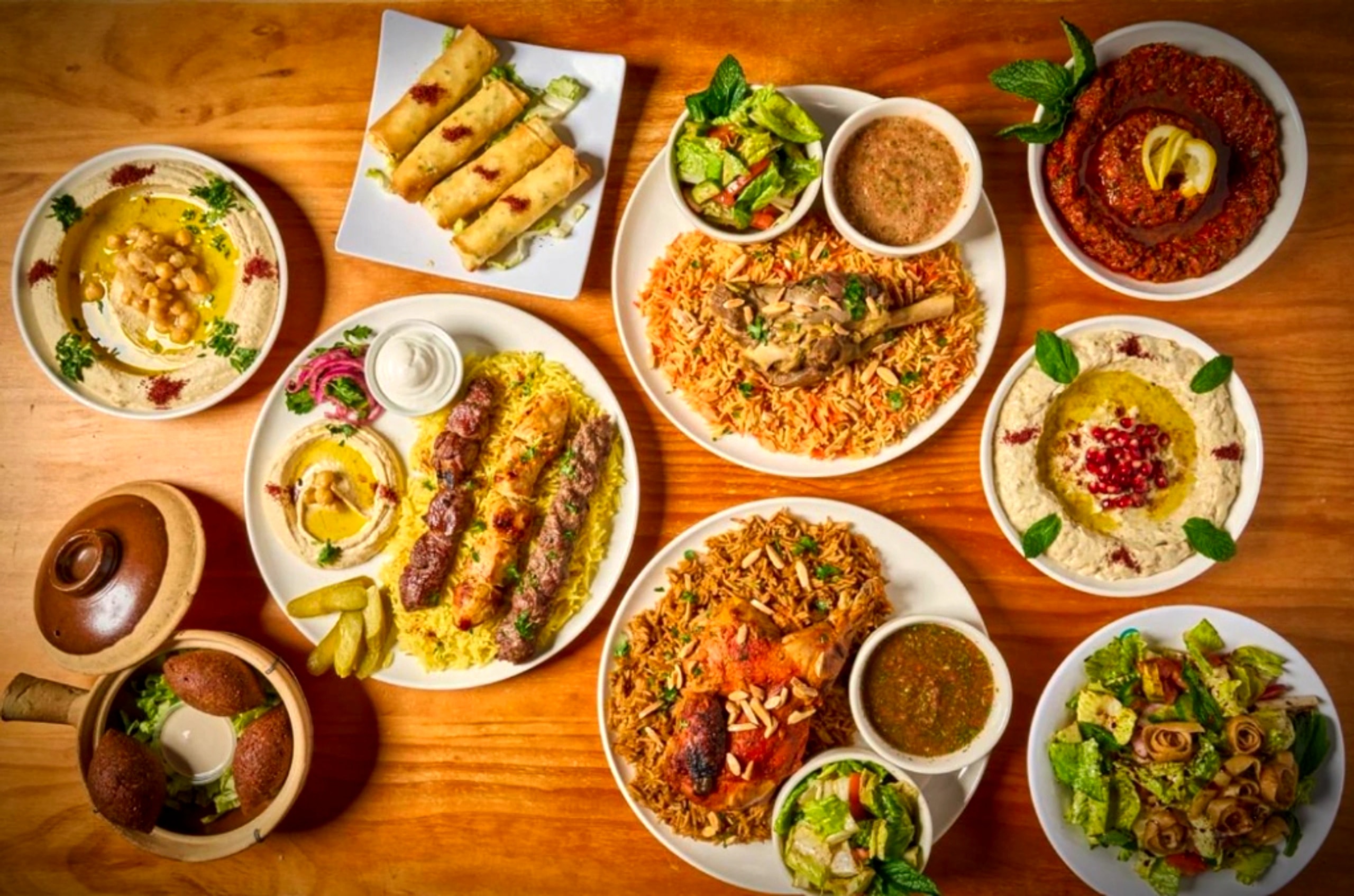 A Damascene table set with mezze, mandi and charcoal-grilled skewers